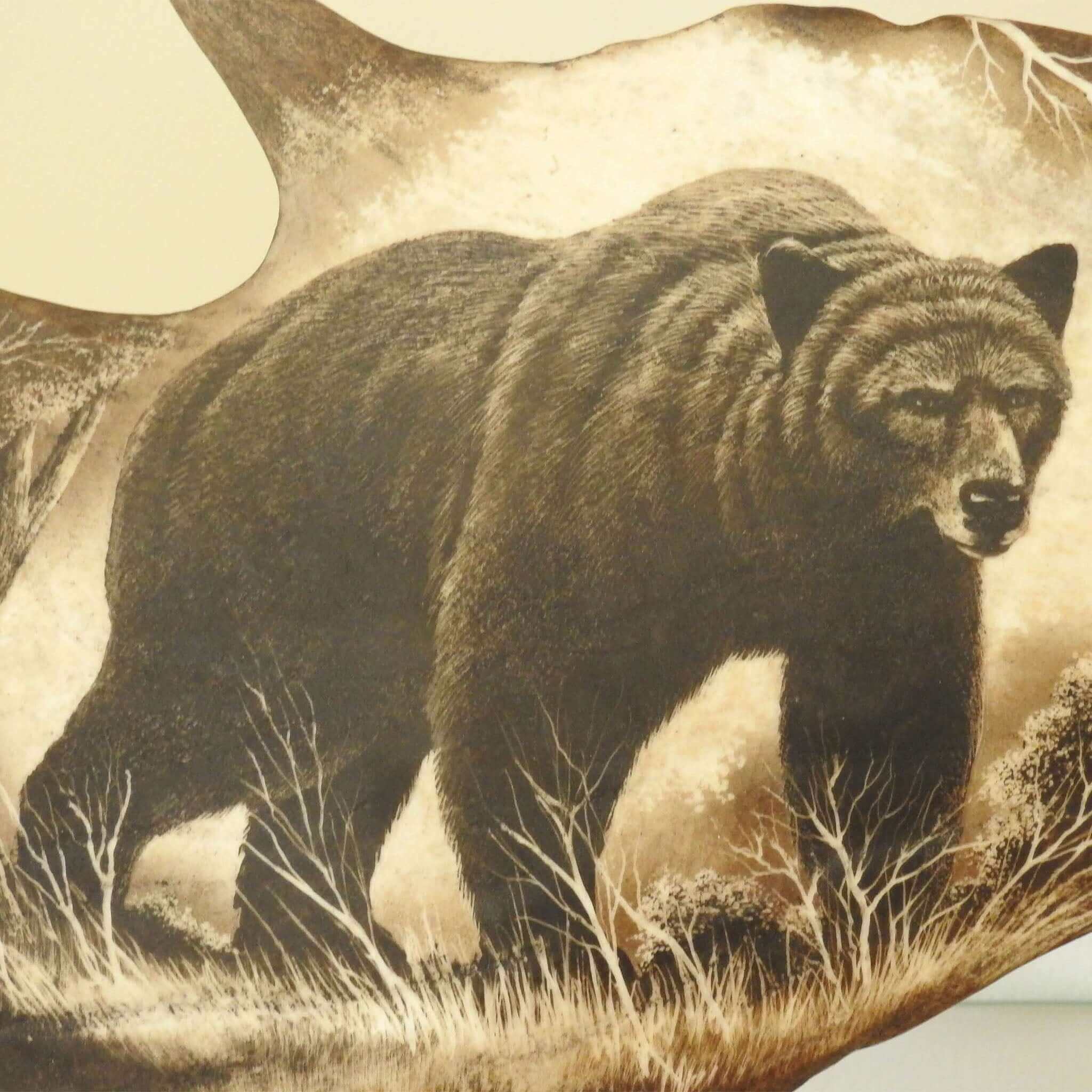 Real antler sculpture shows bear.