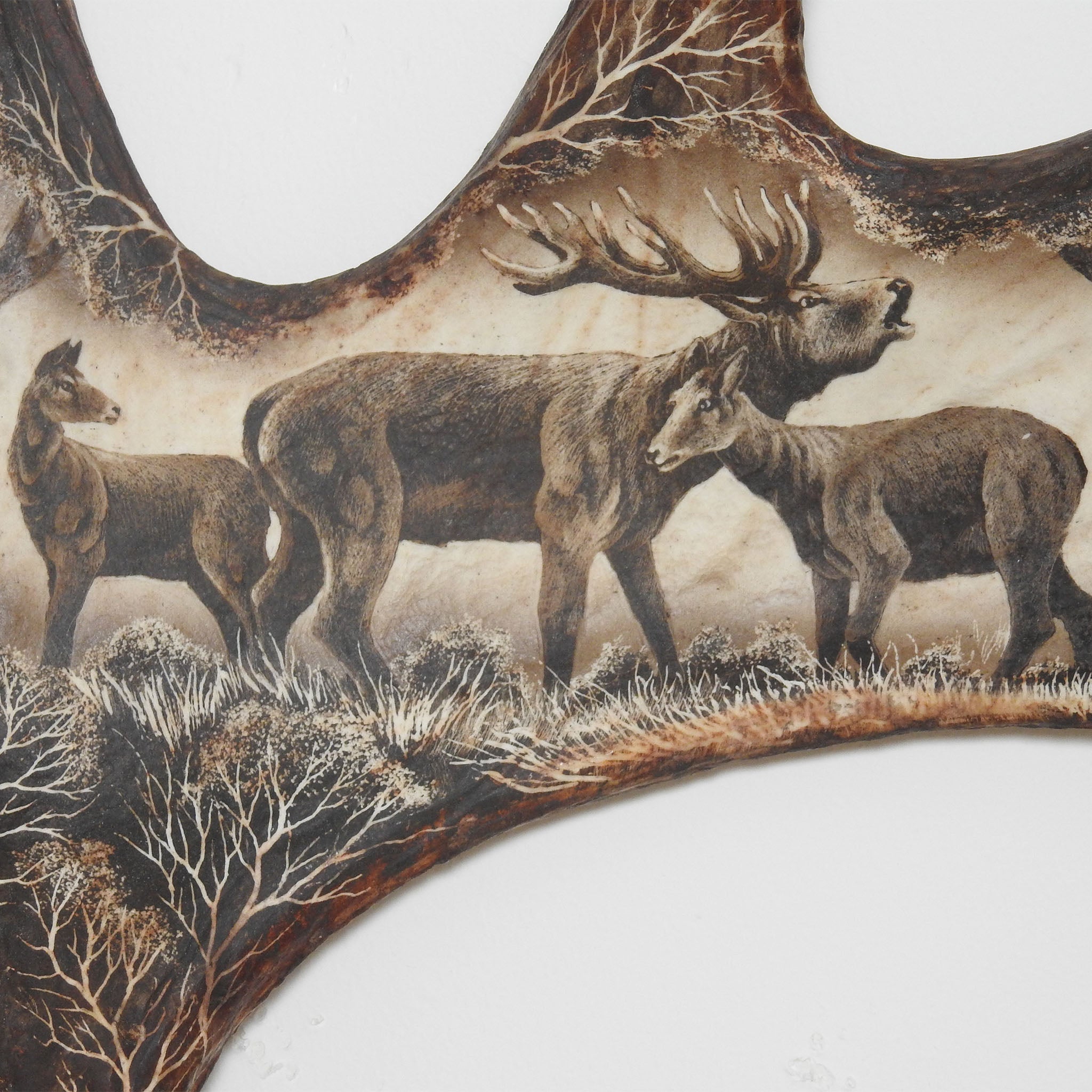Family of deer, antler carving.
