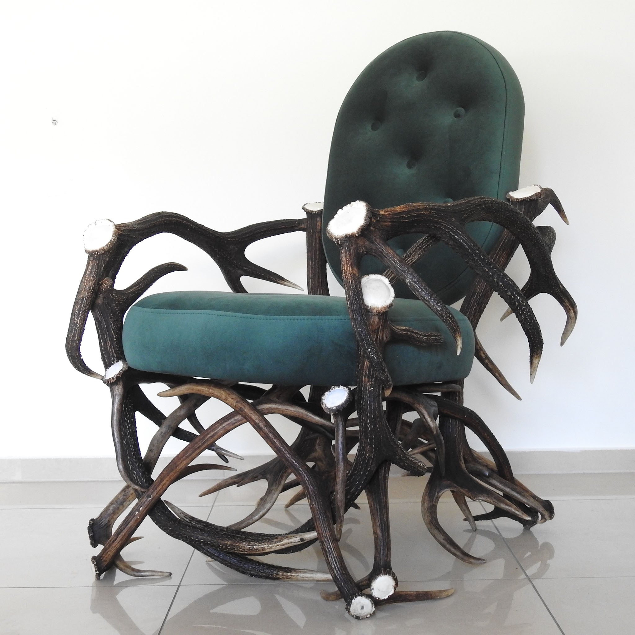 Antler chair with green velvet.