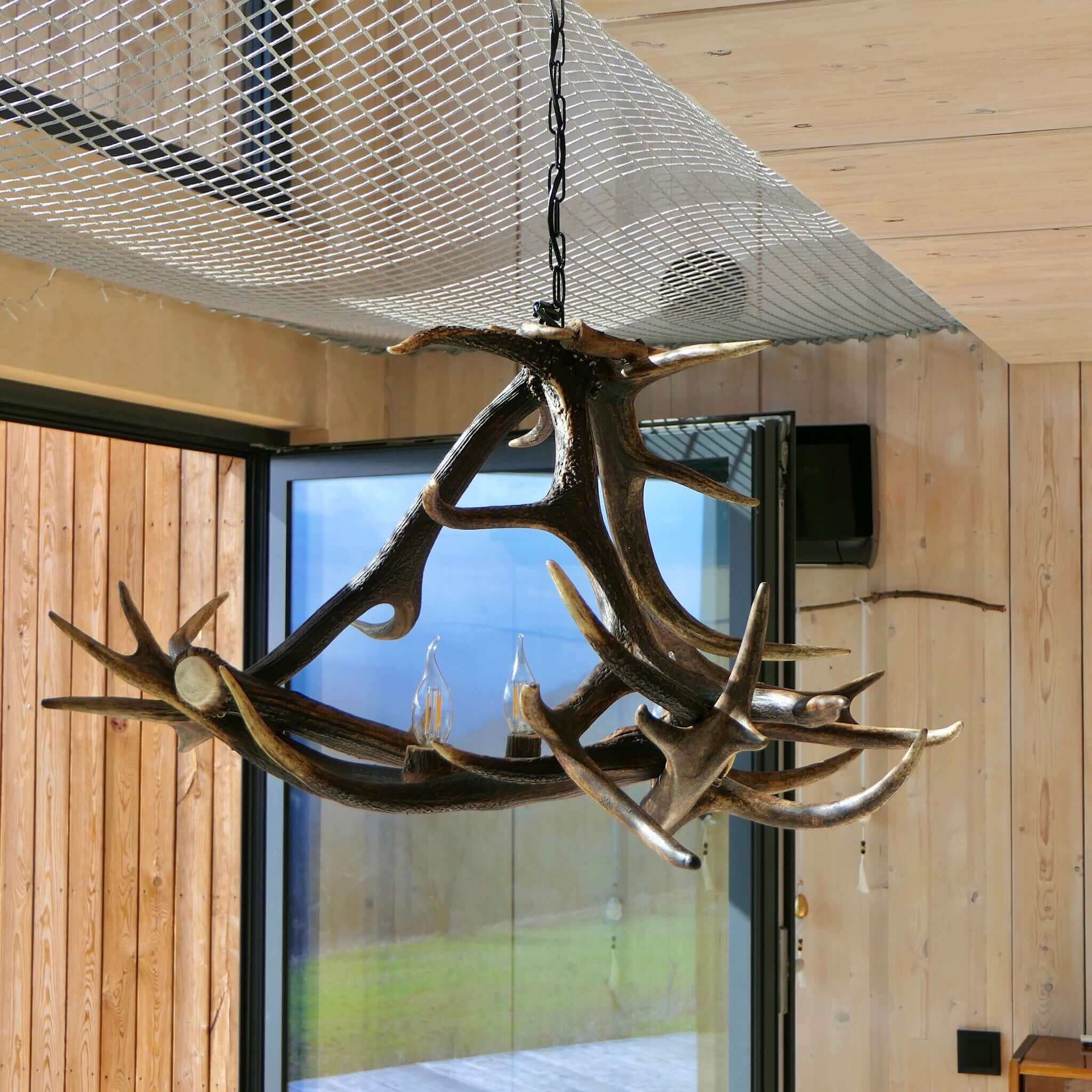 Deer antler chandelier in dinning room.