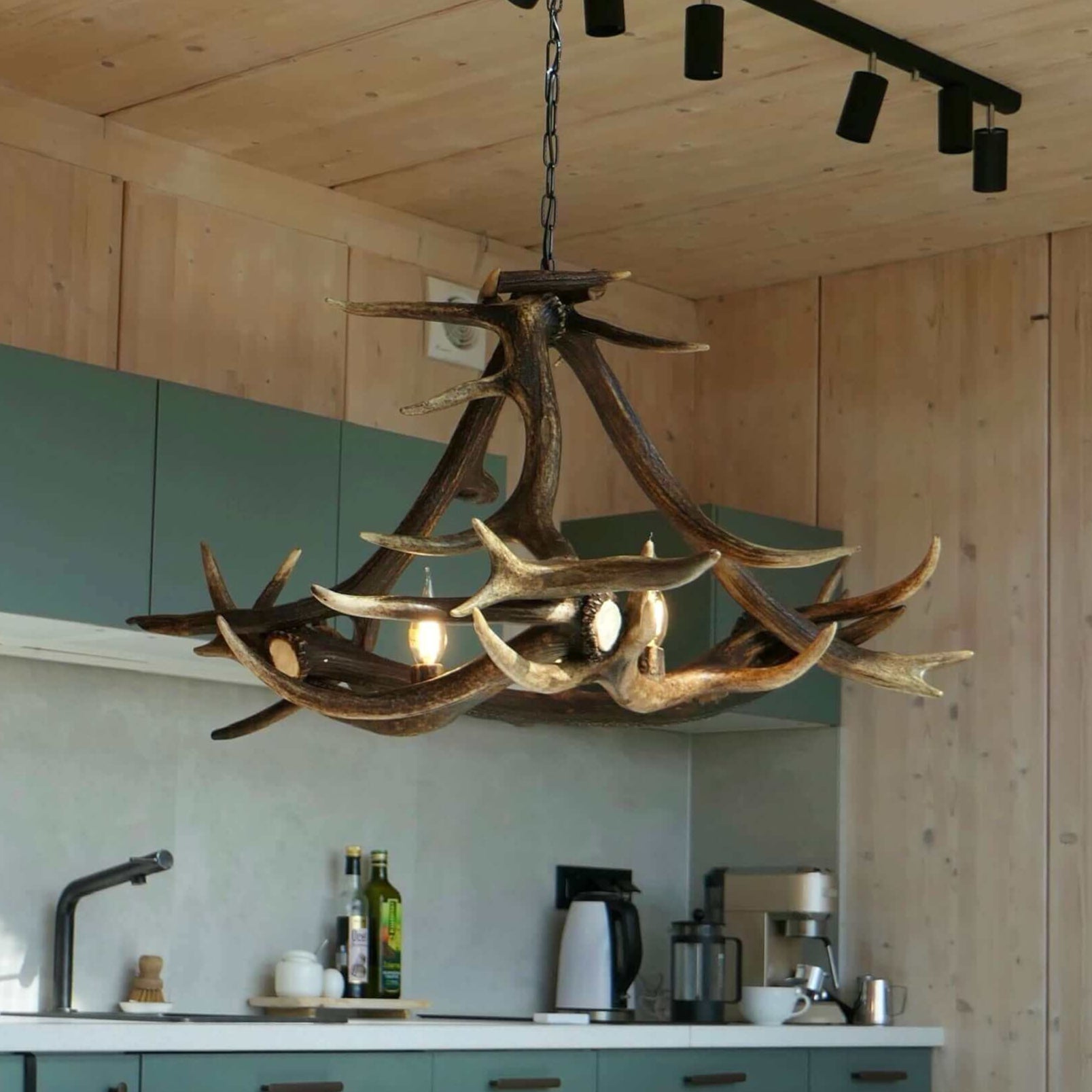 Deer antler chandelier in dinning room.
