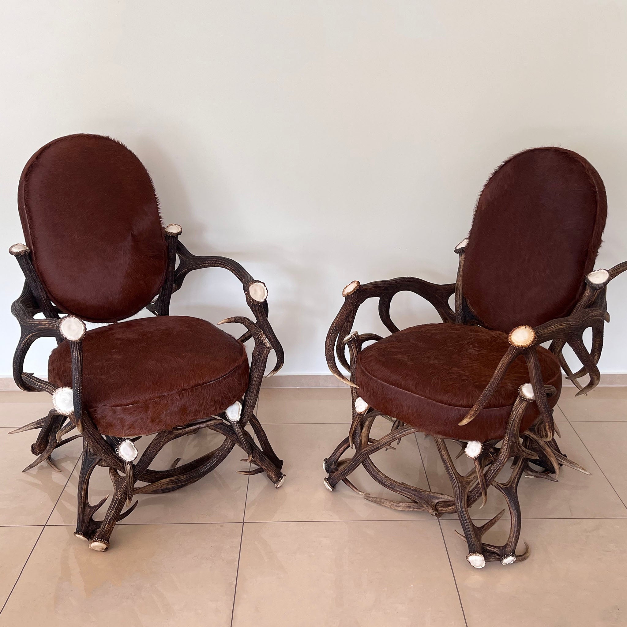 Real deer antler office chairs with fur upholstery.