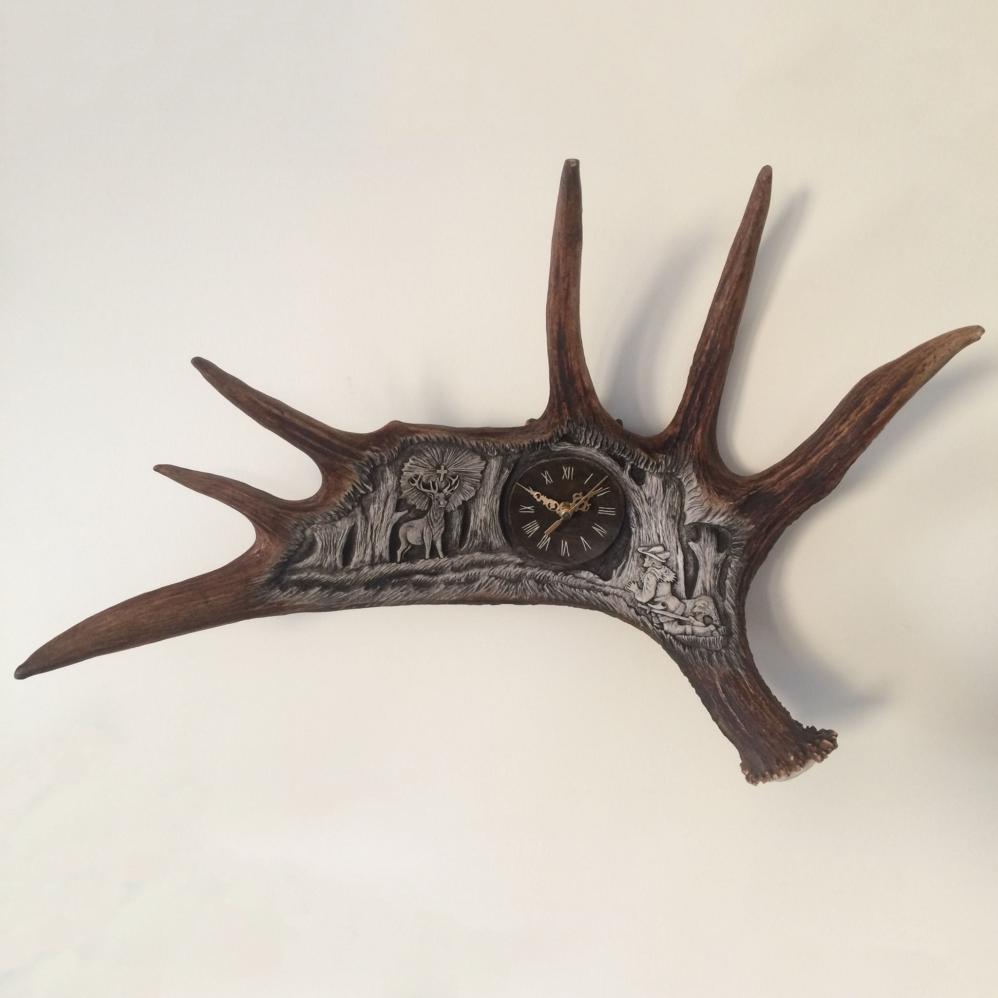 Moose antler carving shows saint Hubert.