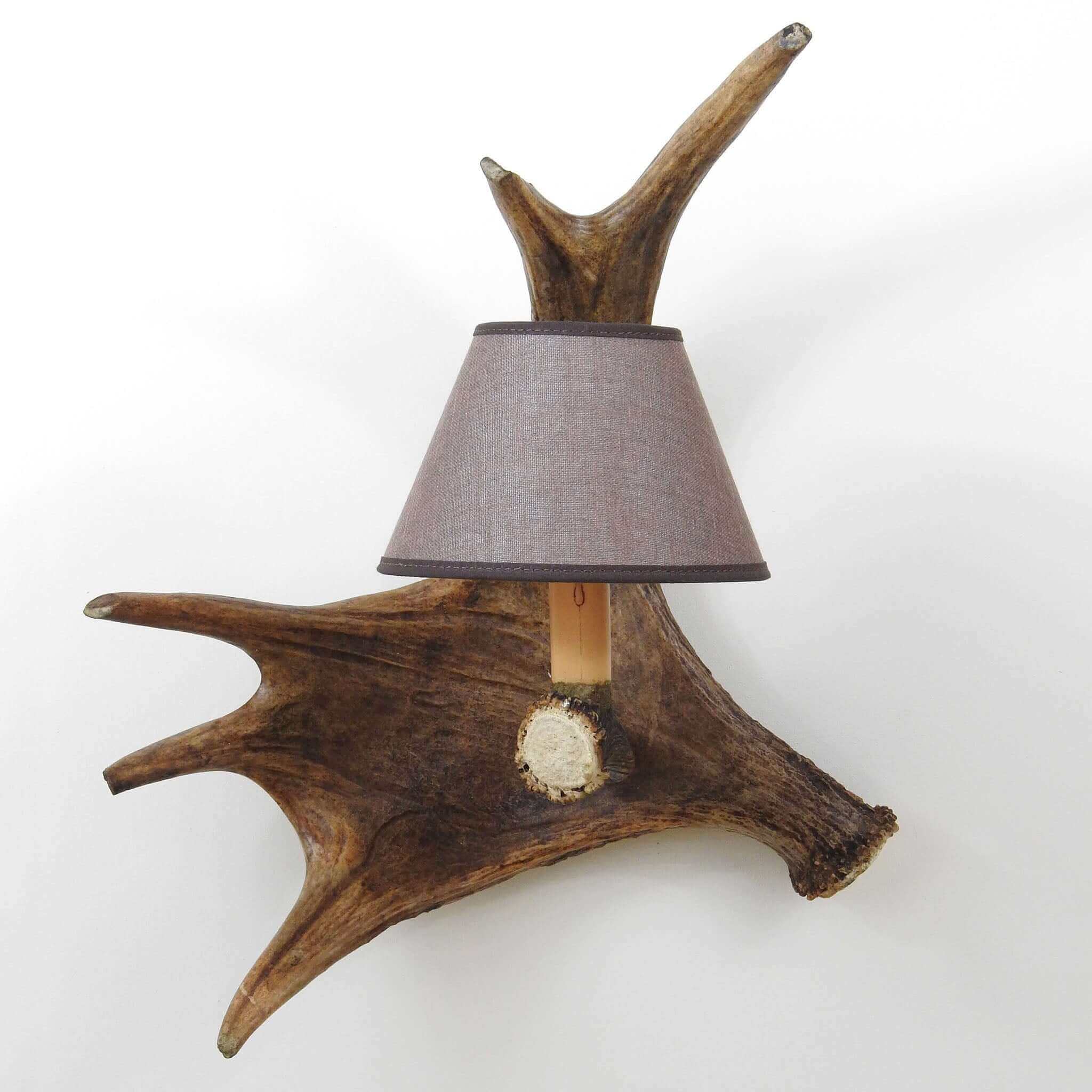 Real antler wall chandelier with shade.