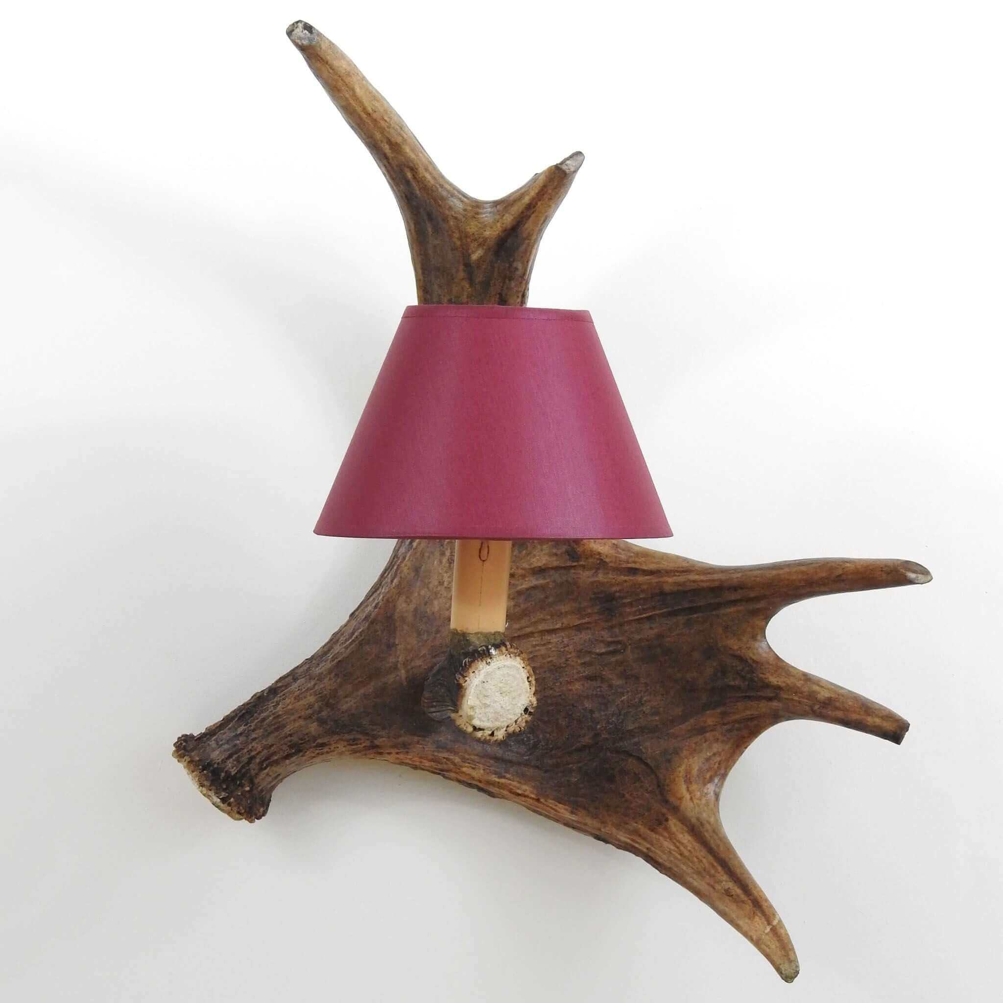 Handmade antler wall sconce.