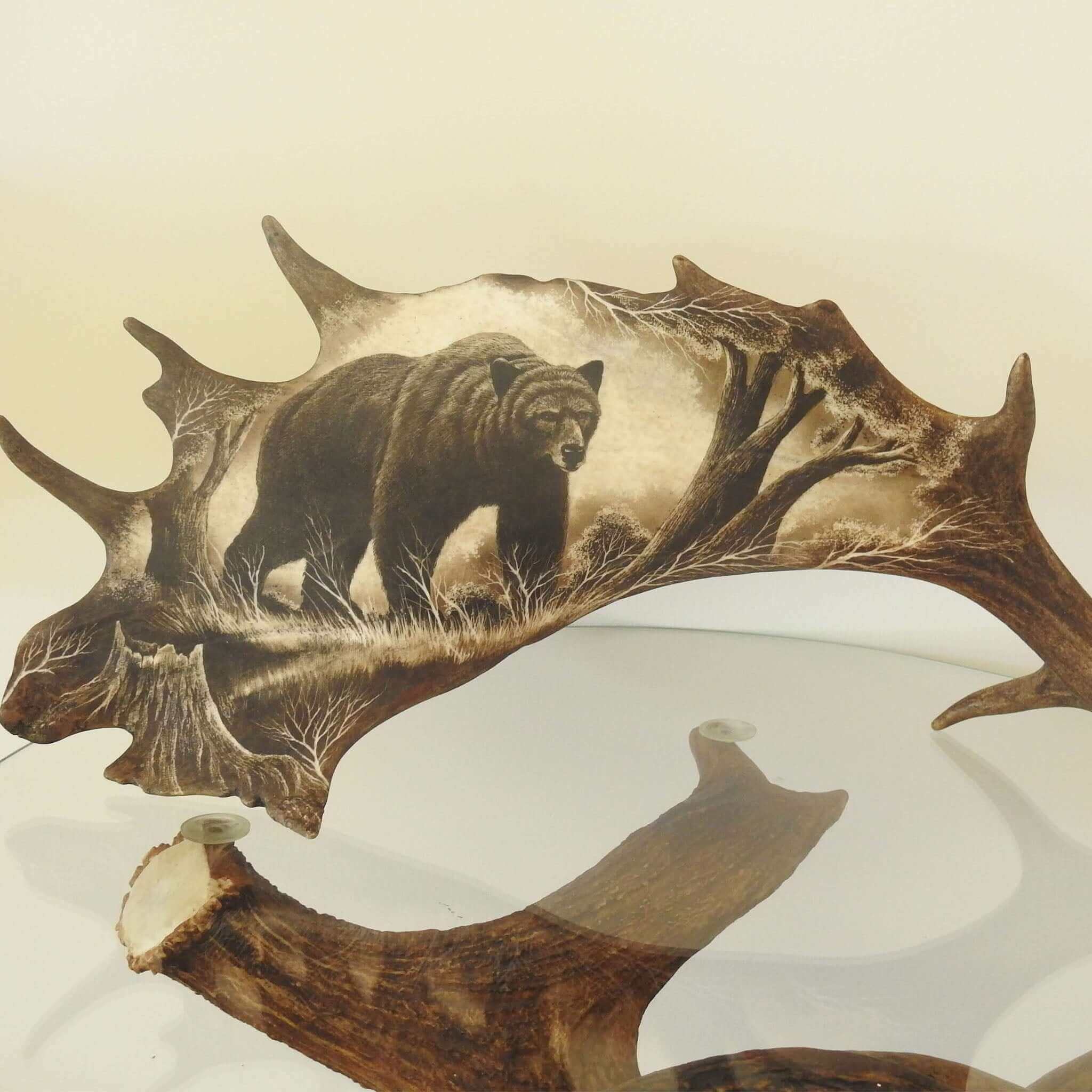 Real antler carving shows bear.