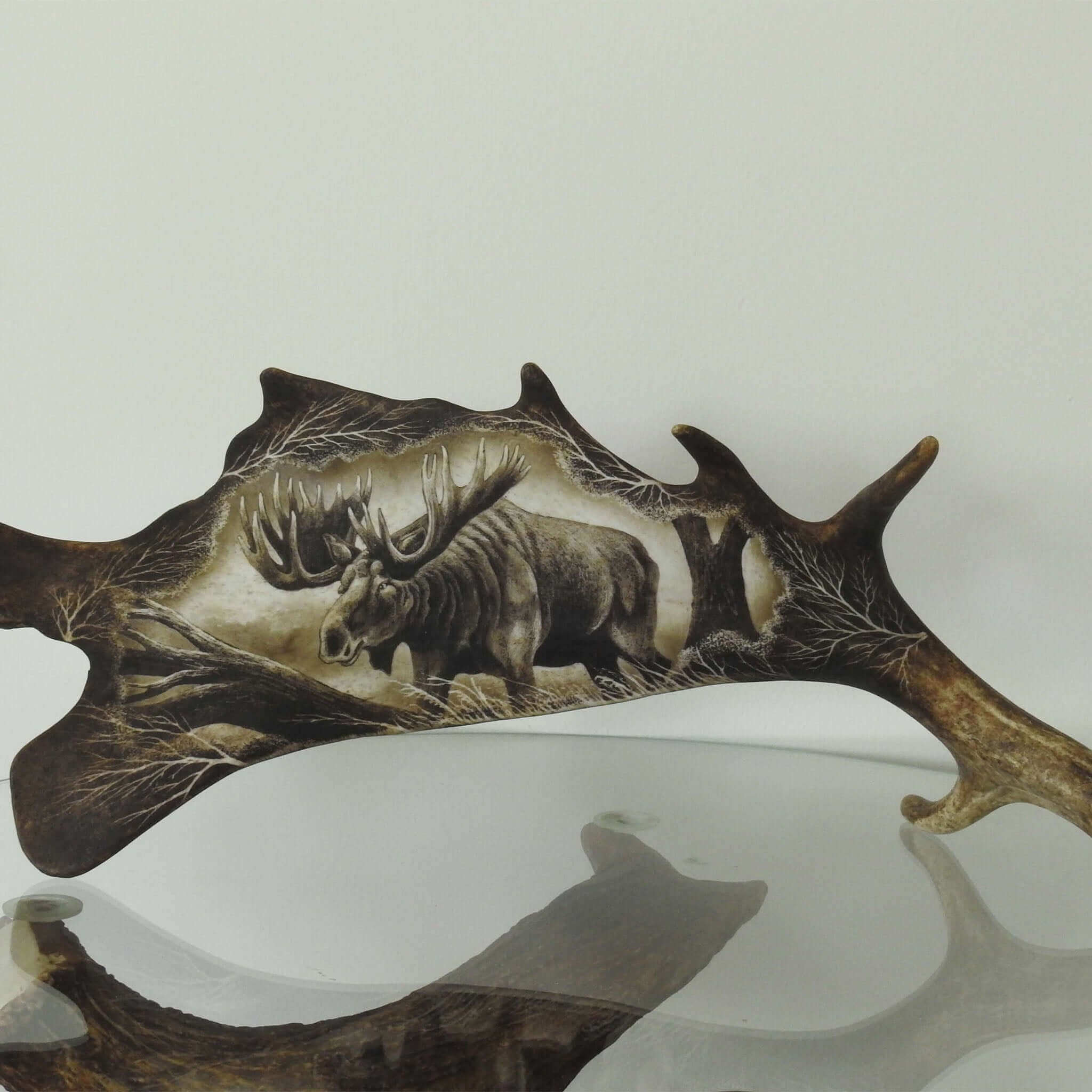 Real antler carving shows moose.