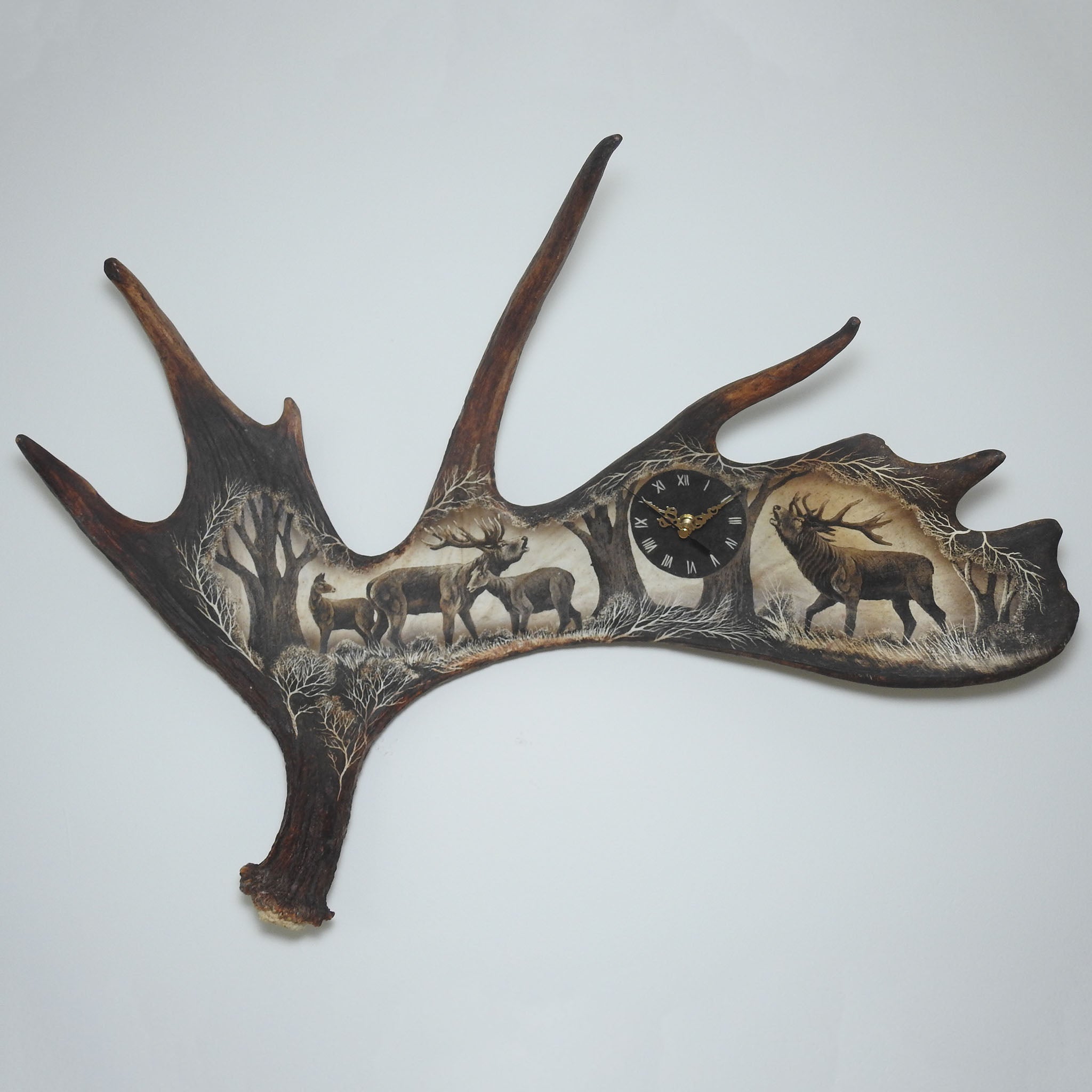 Real moose antler carving shows deer.